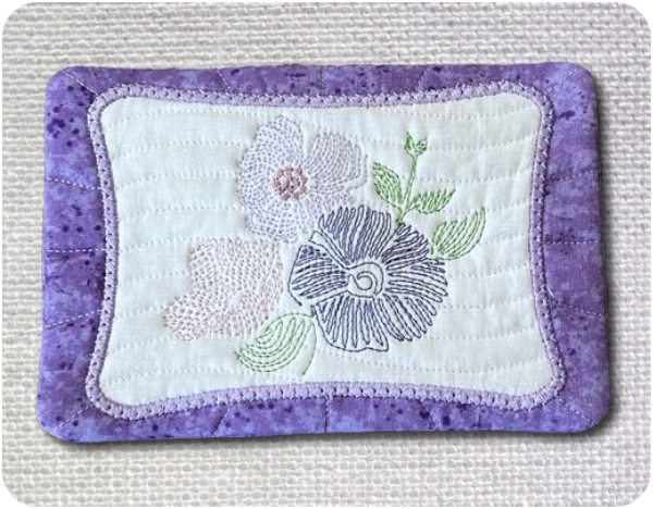 I stitched FG01 onto our Free Procraftinator Coaster.  You can do the same — simply replace the wording with any of the 4x4 floral designs from this set to create a completely new look! 🌸