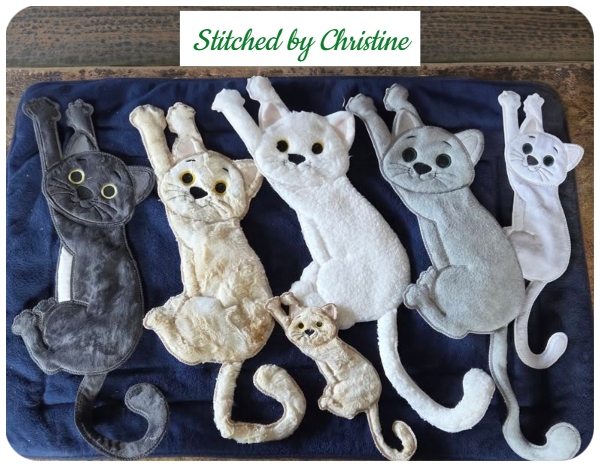 Large Dangling Cats by Christine